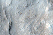 North-Pole-Facing Deposit in Crater Associated with Headwall Erosion
