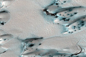 North Polar Residual Ice and Defrosting Dunes