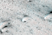 Seasonal Defrosting of West Olympia Region Polar Aeolian-Ice Landforms