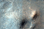 Crater with Fractured Floor North of Ganges Chasma