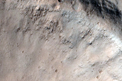 North-Pole-Facing Deposit in Crater Associated with Headwall Erosion