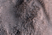 North-Pole-Facing Deposit in Crater Associated with Headwall Erosion