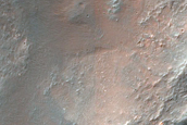 Impact Crater with Central Uplift and Bedrock Exposures