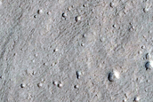 North-Pole-Facing Deposit in Crater with Headwall Erosion