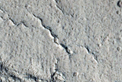 North-Pole-Facing Deposit in Crater Associated with Headwall Erosion
