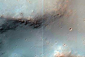 Impact Crater Exposing Bedrock