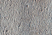 North-Pole-Facing Deposit in Crater Associated with Headwall Erosion