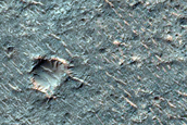 Mafic Mineral Exposure on Plains West of Herschel Crater