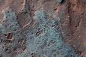Light-Toned Deposits in Crater South of Coprates Chasma
