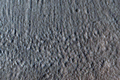 North-Pole-Facing Deposit in Crater Associated with Headwall Erosion