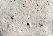 Crater with Glacier Fill and Contrasting Ejecta