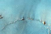 Crater Ejecta with Hydrated Materials in Syrtis Major Planum