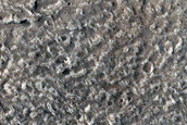 North-Pole-Facing Deposit in Crater Associated with Headwall Erosion