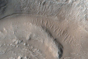 North-Pole-Facing Deposit in Crater Associated with Headwall Erosion