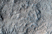 North-Pole-Facing Deposit in Crater Associated with Headwall Erosion