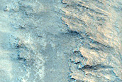 Layered Bedrock Exposed in Crater Wall on Antoniadi Crater Floor