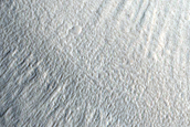 North-Pole-Facing Deposit in Crater Associated with Headwall Erosion
