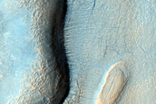Layered Features in Craters in Northern Mid-Latitudes