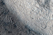Pole-Facing Deposit in 10-Kilometer Crater