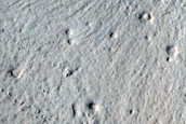 North-Pole-Facing Deposit in Crater Associated with Headwall Erosion