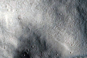 Dark Deposit in Crater in Tempe Terra