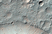Flow-Like Deposit Associated with Molesworth Crater Peak-Ring Structure