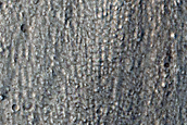 North-Pole-Facing Deposit in Crater Associated with Headwall Erosion