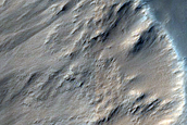 Impact Related Deposits and Flows near Pettit Crater
