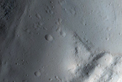North-Pole-Facing Deposit in Crater Associated with Headwall Erosion