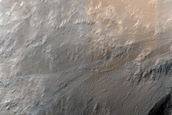 Impact-Related Deposits and Flows around Crater Southwest of Pettit Crater