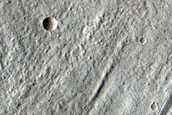 North-Pole-Facing Deposit in Crater Associated with Headwall Erosion