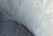 North-Pole-Facing Deposit in Crater Associated with Headwall Erosion