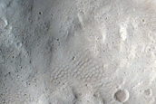 North-Pole-Facing Deposit in Crater Associated with Headwall Erosion