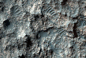 Central Peak and Rocky Layers on Floor of 70-Km Crater in Terra Cimmeria