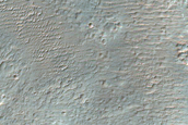 Channel Interacting with Crater in Ladon Valles Basin
