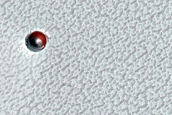 Small Ice-Filled Crater on North Polar Layered Deposits