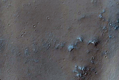 Curved Channel Leading to Trough in Syria Planum
