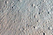 North-Pole-Facing Deposit in Crater Associated with Headwall Erosion