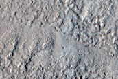 North-Pole-Facing Deposit in Crater Associated with Headwall Erosion