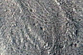North-Pole-Facing Deposit in Crater Associated with Headwall Erosion