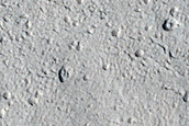 North-Pole-Facing Deposit in Crater Associated with Headwall Erosion