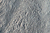 Ice-Filled Impact Crater with Rumpled Ejecta