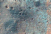 Bright Material in Crater Rim South of Eos Chasma