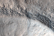 North-Pole-Facing Deposit in Crater Associated with Headwall Erosion