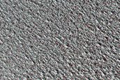 Small Ice-Filled Crater in North Polar Layered Deposits