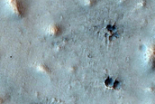 Cratered Cones in Northern Plains