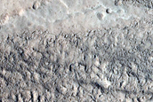 North-Pole-Facing Deposit in Crater Associated with Headwall Erosion
