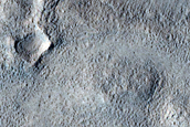 Streamlined Shape and Possible Bar South of Semeykin Crater