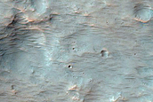 Impact Related Deposits and Flows Northeast of Hellas Planitia
