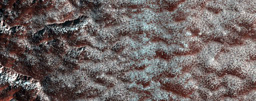 Scalloped Depressions and Seasonal Frost